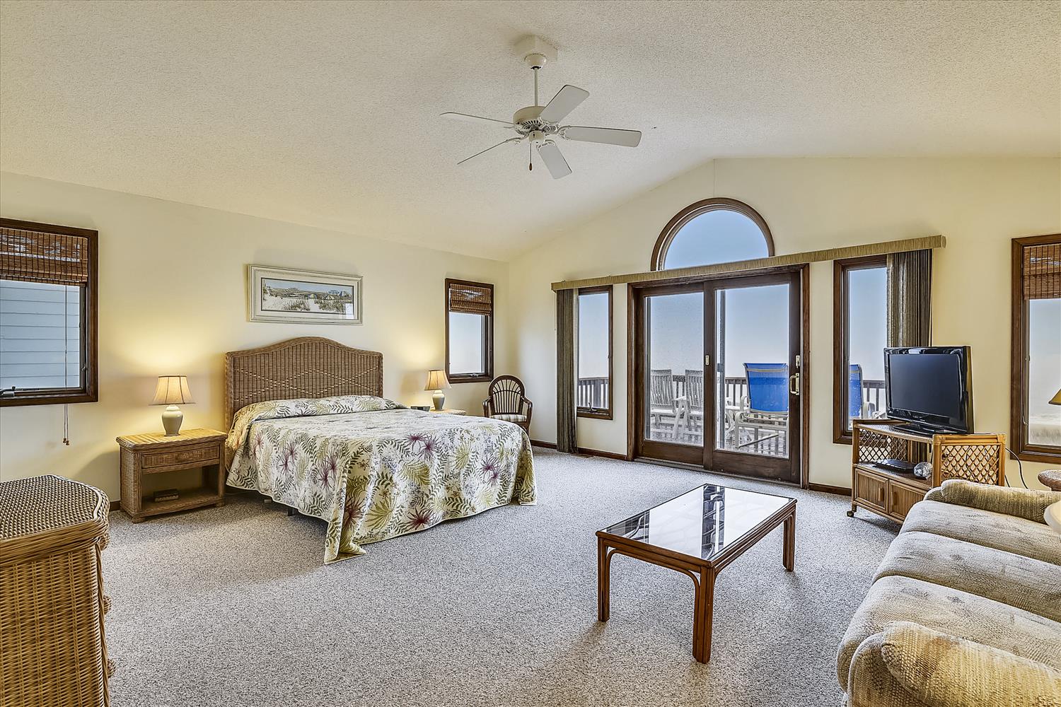 Your spacious bedroom suite opens to a private deck with breathtaking ocean views, where gentle breezes and the sound of waves create the perfect coastal retreat.
