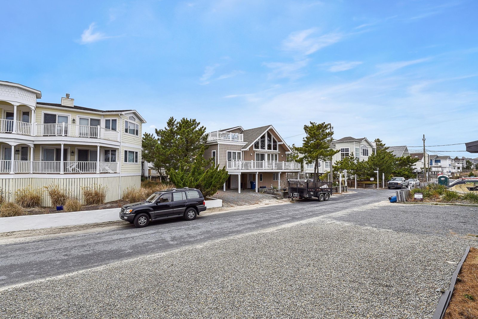 Situated on a peaceful coastal street with neighboring beach homes and easy access to the shore.