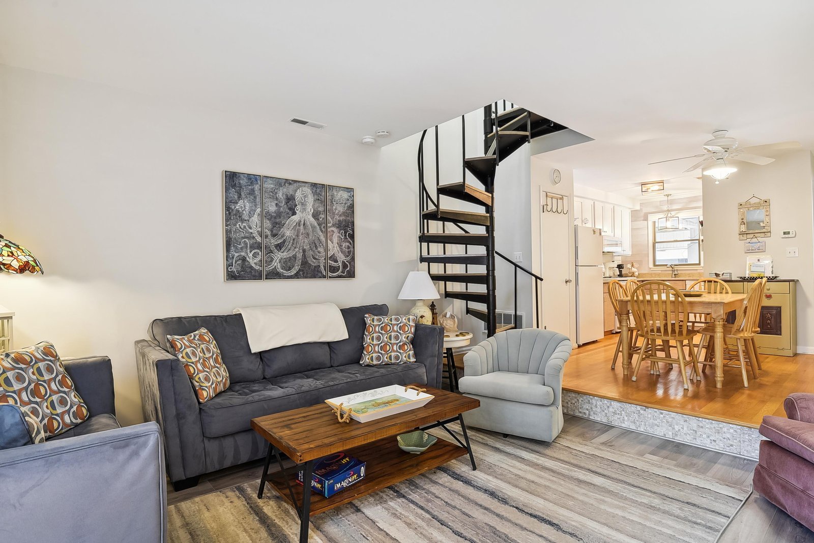 Relax in your open-concept living space, where a cozy sitting area flows into the dining and kitchen—perfect for unwinding after a day of adventure or gathering with loved ones.