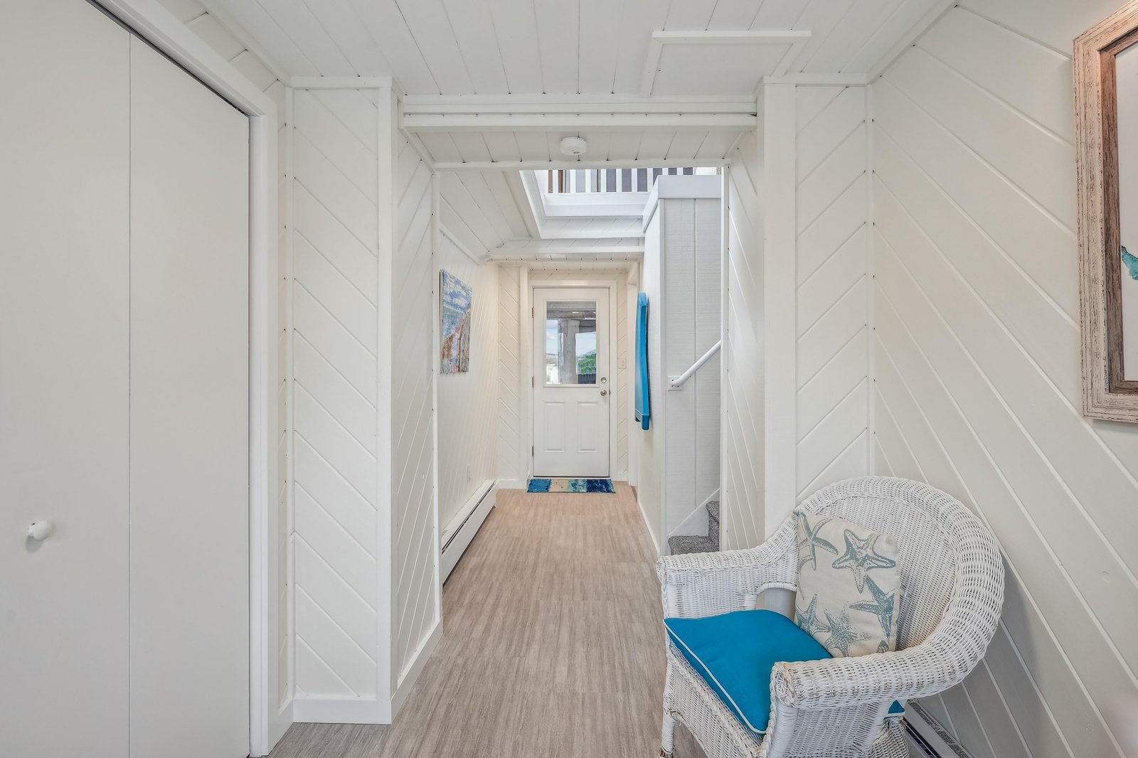 Coastal charm welcomes you home through crisp white shiplap walls and beachy accents that set the tone for your seaside retreat.