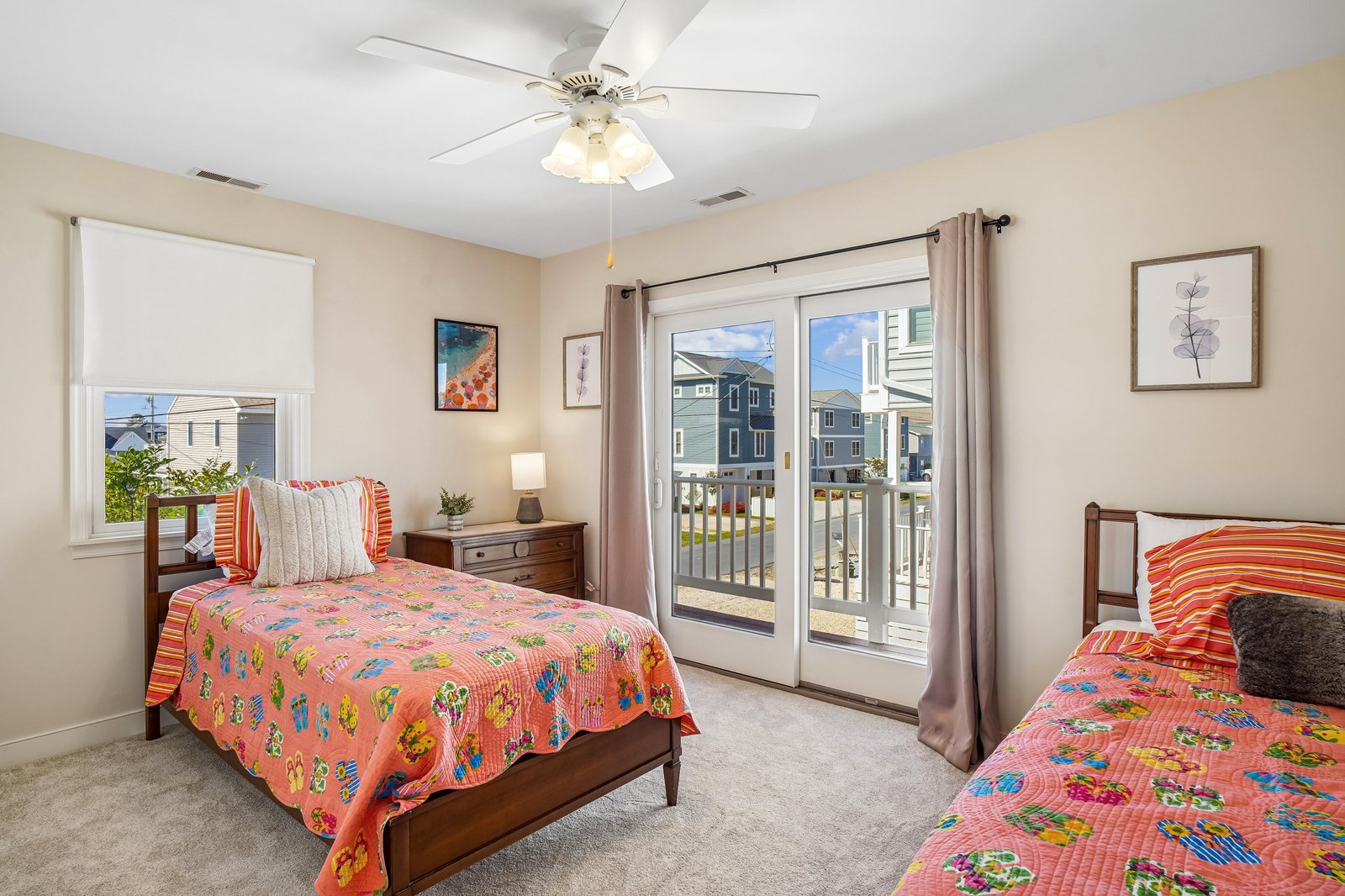 Two cozy beds await your group in this bright, cheerfully decorated bedroom with French doors opening to your own private balcony overlooking the neighborhood.