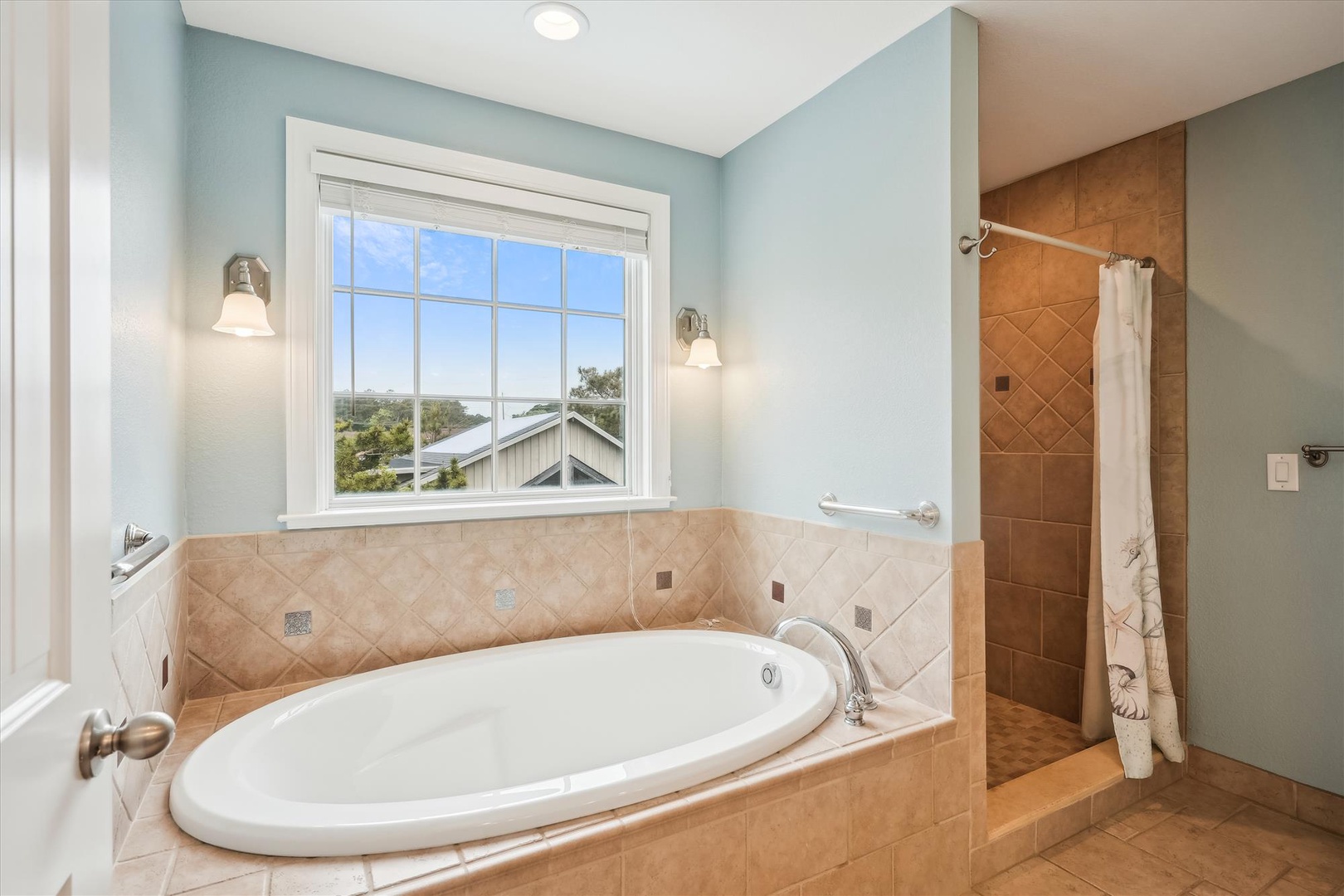 Picture yourself soaking in this elegant tub, gazing through the window at serene views, while soft lighting and luxurious finishes create your perfect retreat.