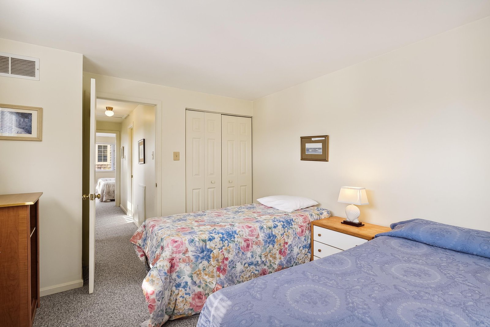 Your peaceful retreat features two comfortable beds, soft lighting, and plenty of closet space—perfect for settling in and unwinding after a day of adventures.