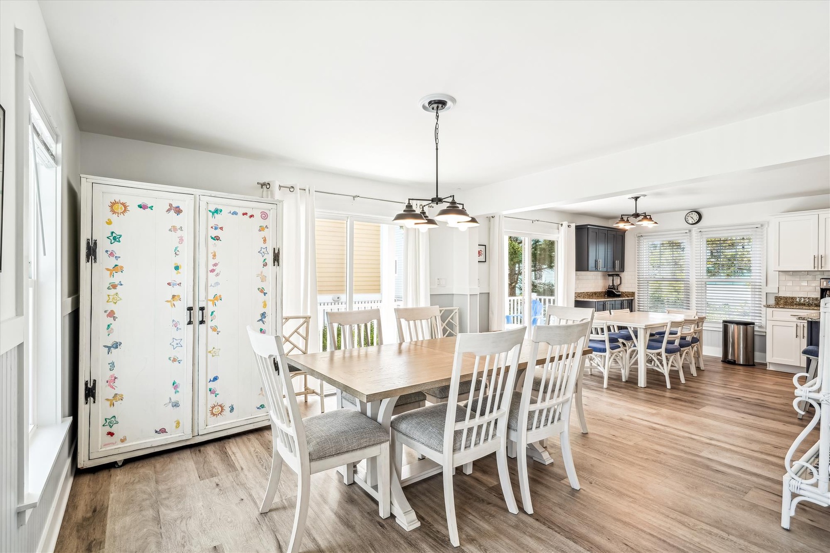 Gather around this spacious farmhouse-style dining table with seating for twelve—perfect for family meals or game nights together.