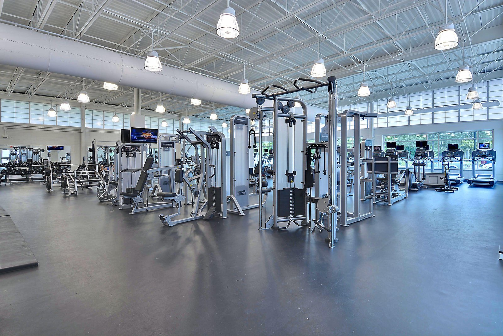 Stay energized in a bright, spacious fitness center with modern equipment and natural light. Work out at your own pace among strength machines, cardio zones, and ample open space to stretch and move freely.