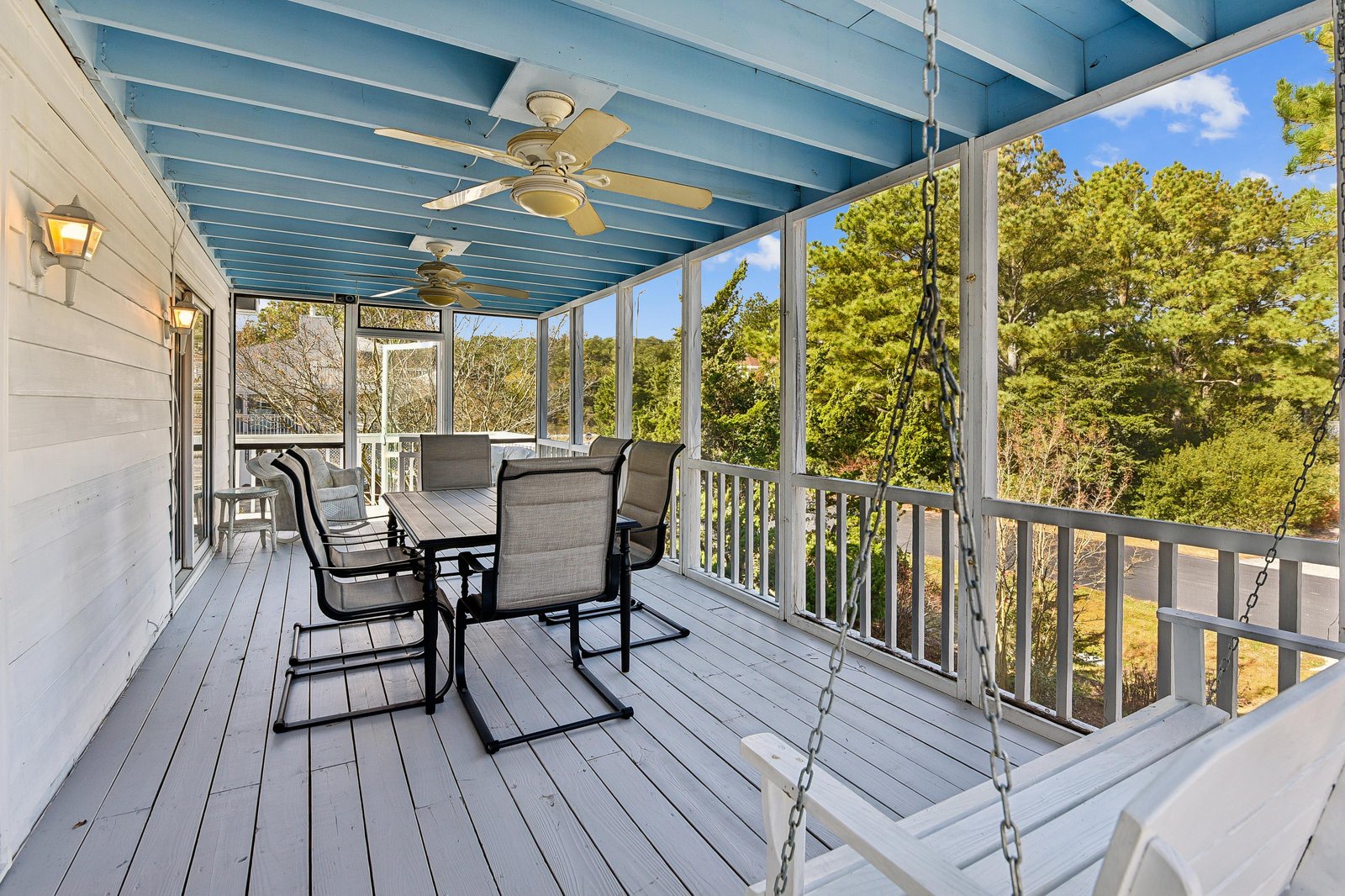Relax on your covered porch with a gentle swing and treetop views, perfect for morning coffee or peaceful evenings surrounded by nature.