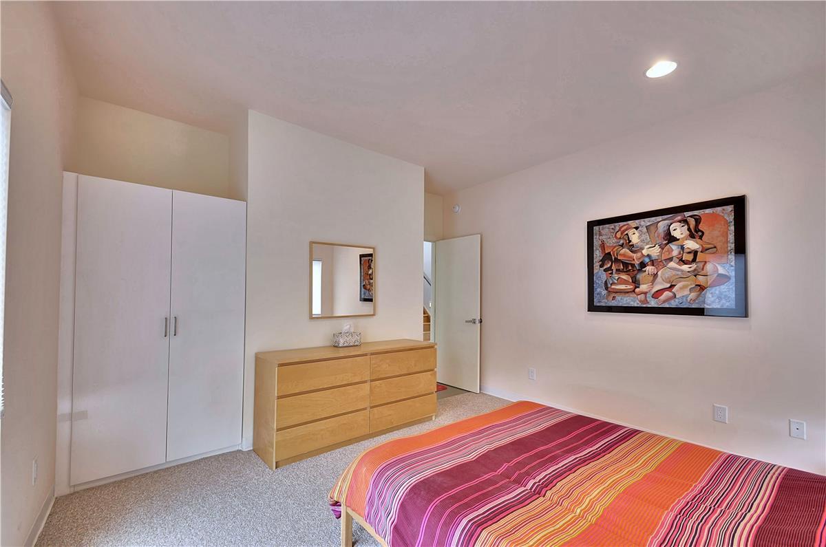 Your serene bedroom retreat awaits with warm lighting, ample wardrobe space, and colorful touches that make it feel instantly like home.