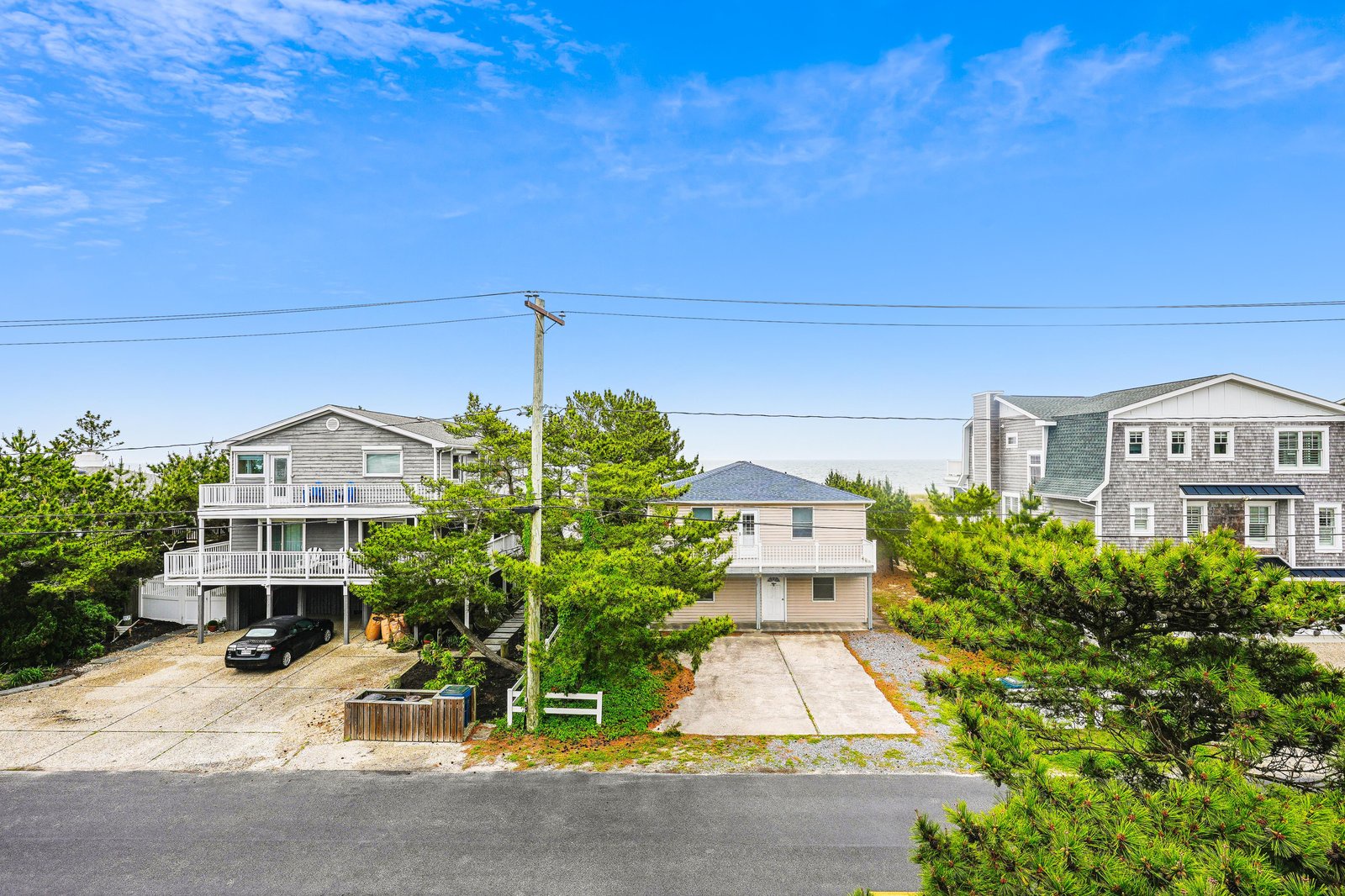 The property is located in a peaceful coastal neighborhood, surrounded by lush greenery and just a short walk to nearby beaches.