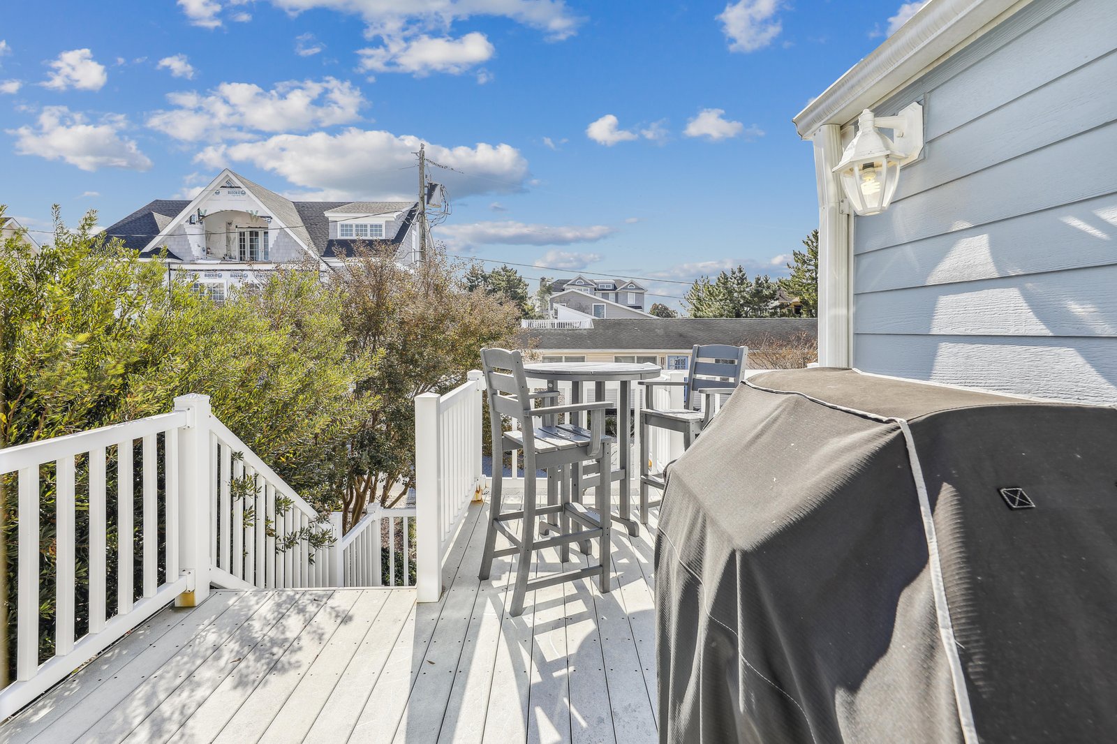 Your private deck awaits, complete with high-top seating for morning coffee and a grill for summer evenings under the coastal sky.
