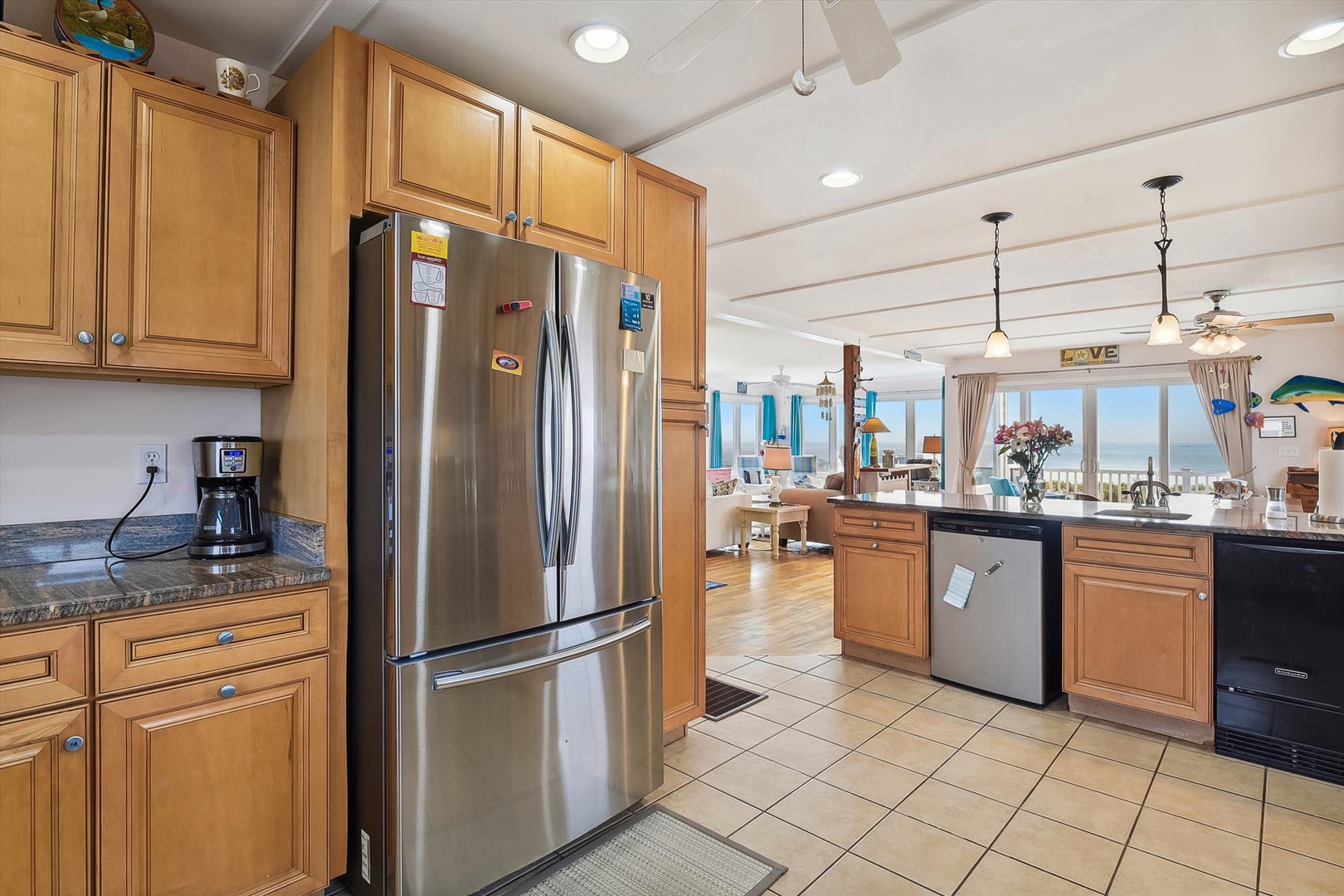 Enjoy your morning coffee in this bright, well-appointed kitchen with stunning ocean views. Cook, gather, and feel right at home with modern appliances and an open flow to the living space.