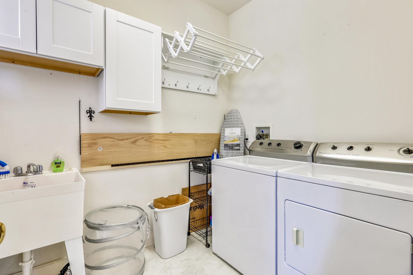 Your private laundry room is stocked with a full-sized washer and dryer, a folding station, and a drying rack—making packing light a breeze.