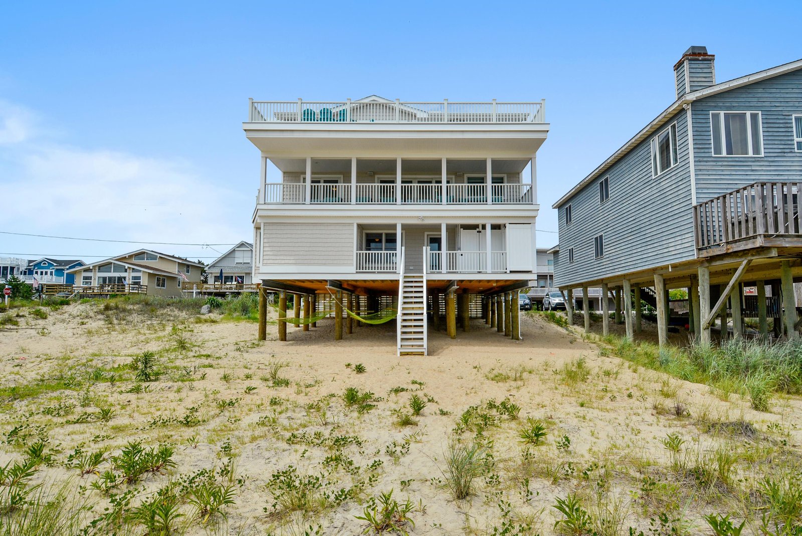 Beachfront property with multiple decks and direct access to sandy shores—just steps from the waves and coastal adventure.
