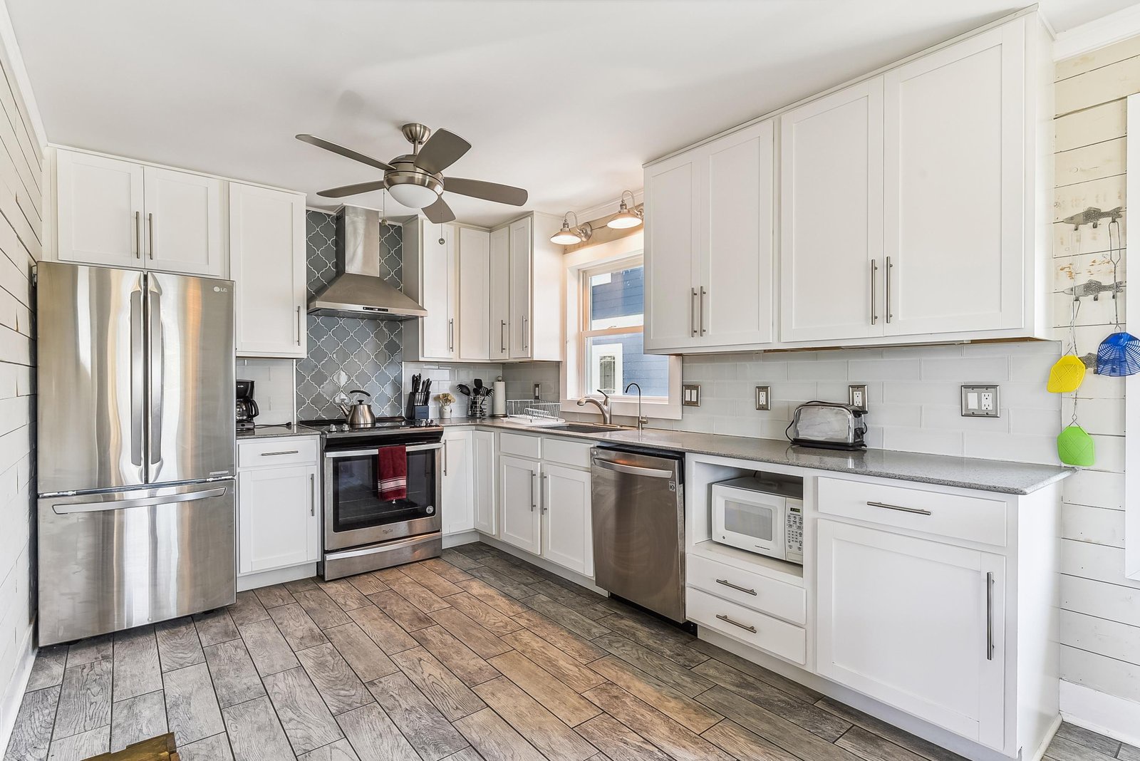 Your private kitchen is fully equipped with stainless steel appliances, pristine white cabinetry, and ample counter space—perfect for preparing your favorite meals during your stay.
