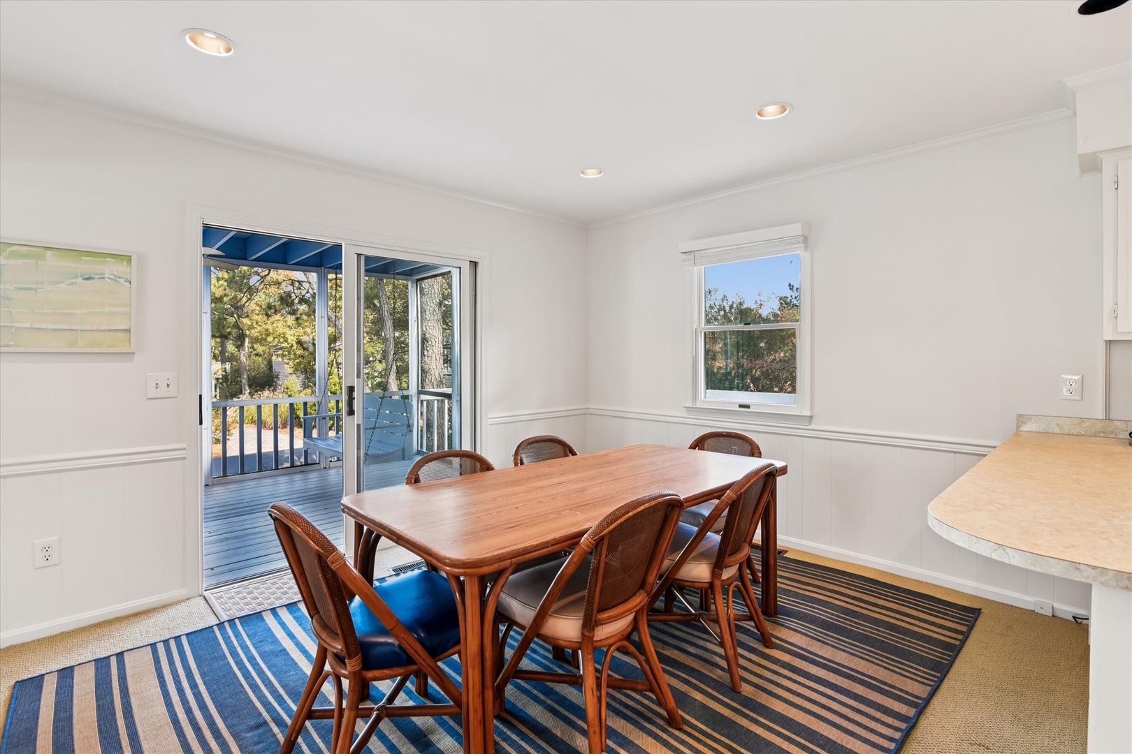 Step into your bright dining space where meals become memorable moments. Natural light fills the room through sliding doors leading to your private deck.