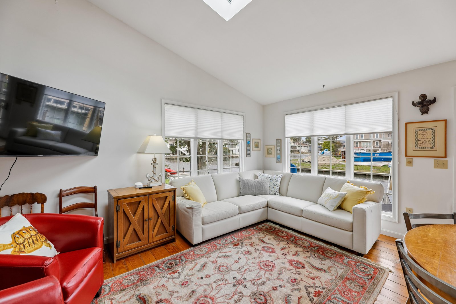 Sink into the plush sectional and let natural light fill your space through floor-to-ceiling windows. A bright skylight overhead adds extra warmth, making this your perfect retreat after a day exploring.