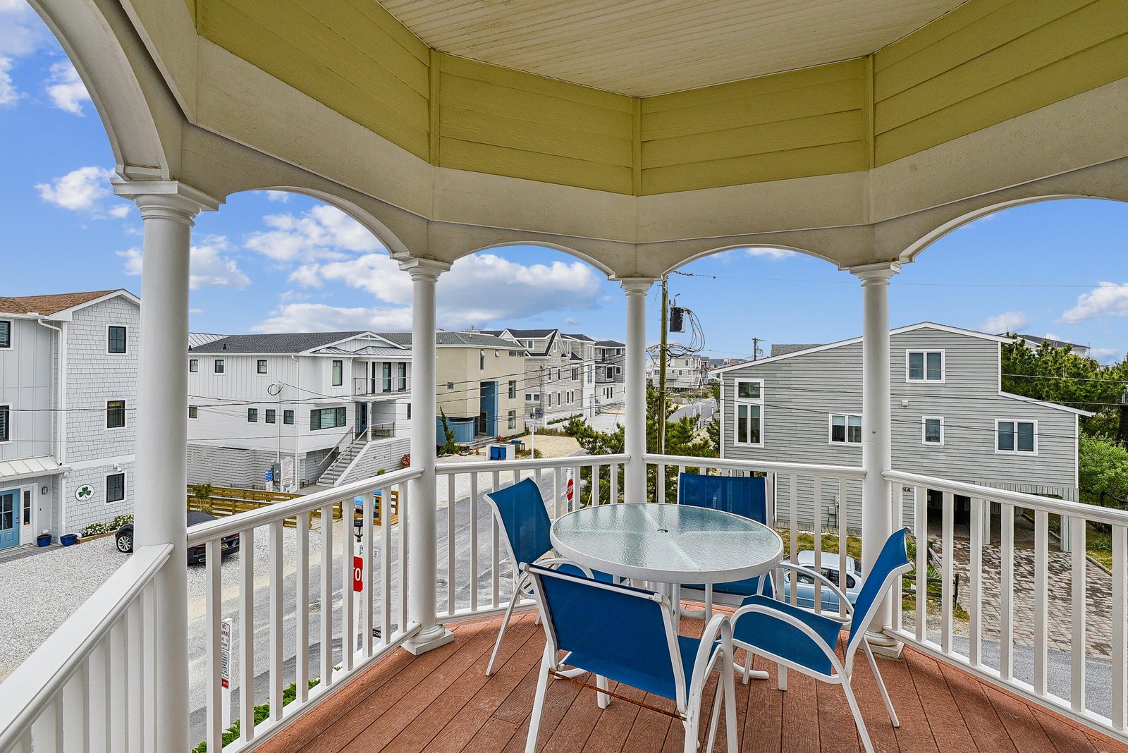 Relax in your private rooftop gazebo with comfortable seating and sweeping views of the surrounding neighborhood on sunny days.