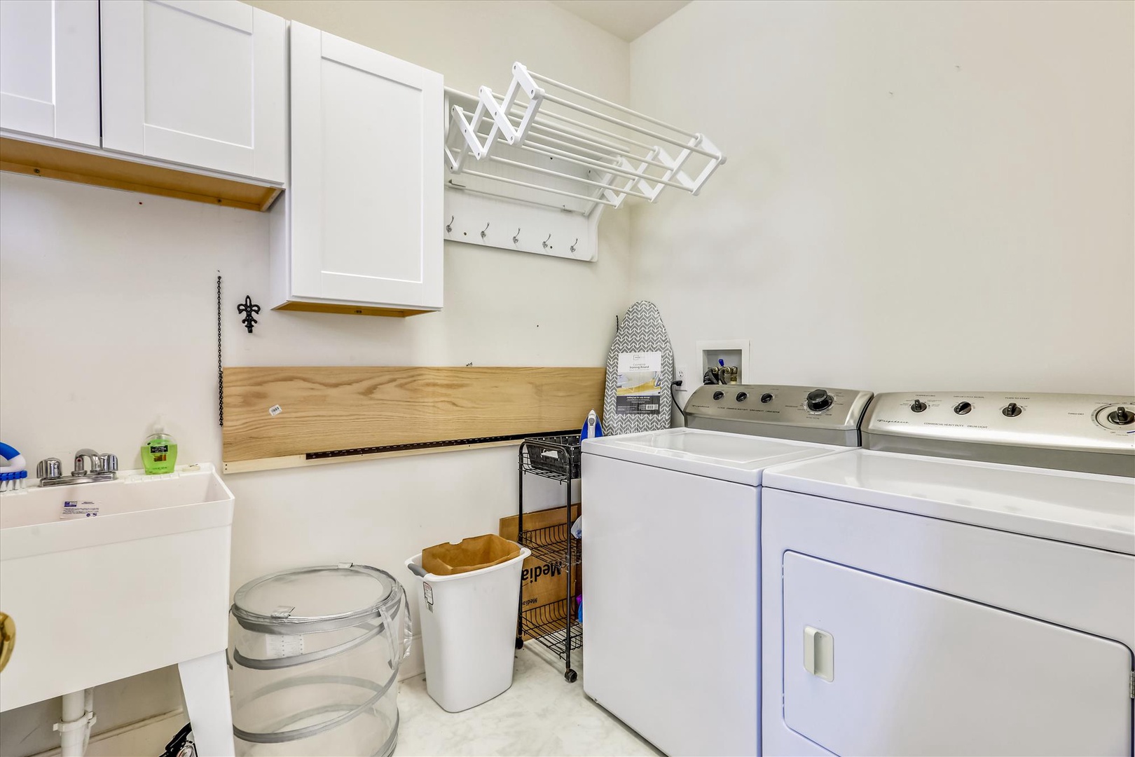 A well-organized laundry area with a washer and dryer, ready for your convenience during your stay.