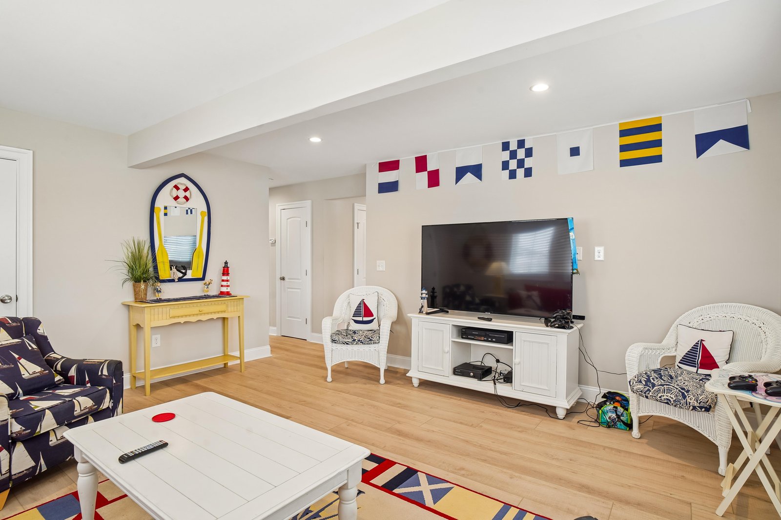 Unwind in your nautical-themed living space, where coastal charm meets comfort—perfect for kicking back after a day of exploring.