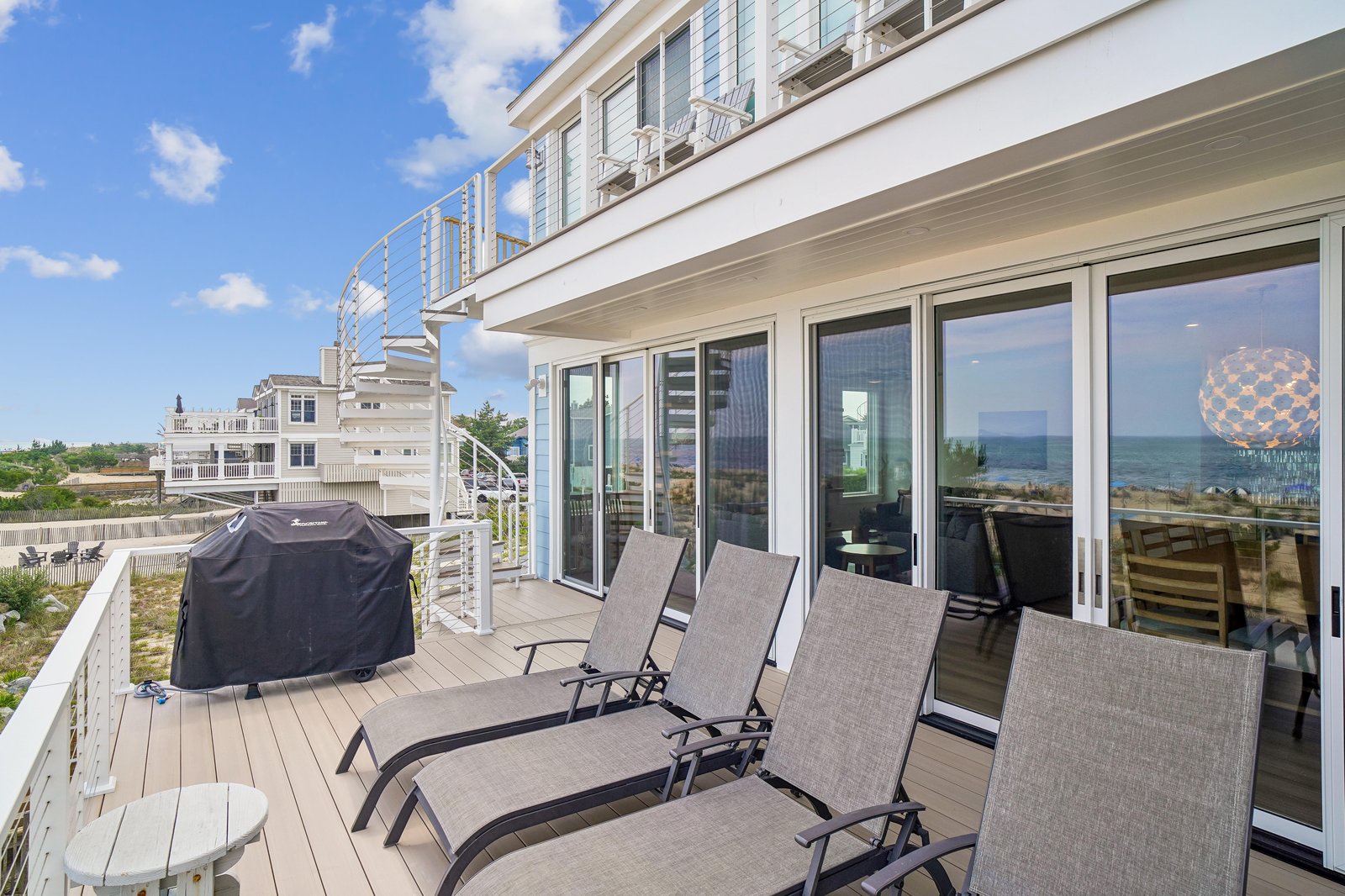 Stretch out on your private deck and soak in stunning ocean views—a peaceful retreat where the horizon meets relaxation.