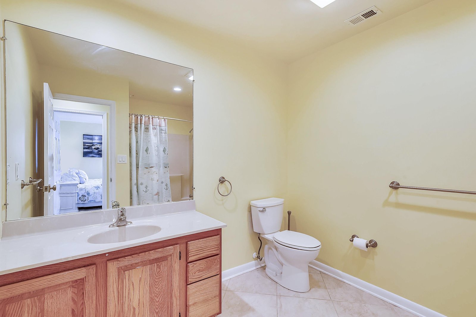 A bright, well-appointed bathroom with a spacious vanity and peaceful ambiance—your personal retreat after a day of exploring.