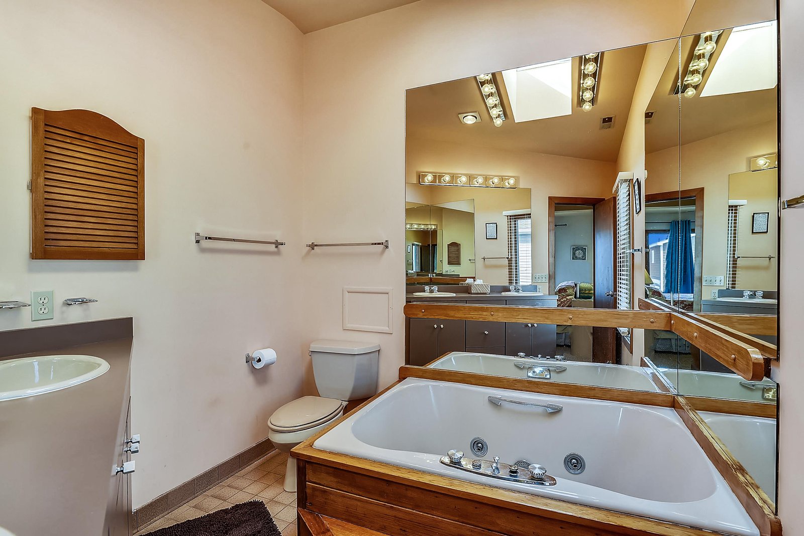 Unwind in your spa-like bathroom with a luxurious jetted tub, dual sinks, and warm lighting—designed for relaxation and pampering after a day of adventure.