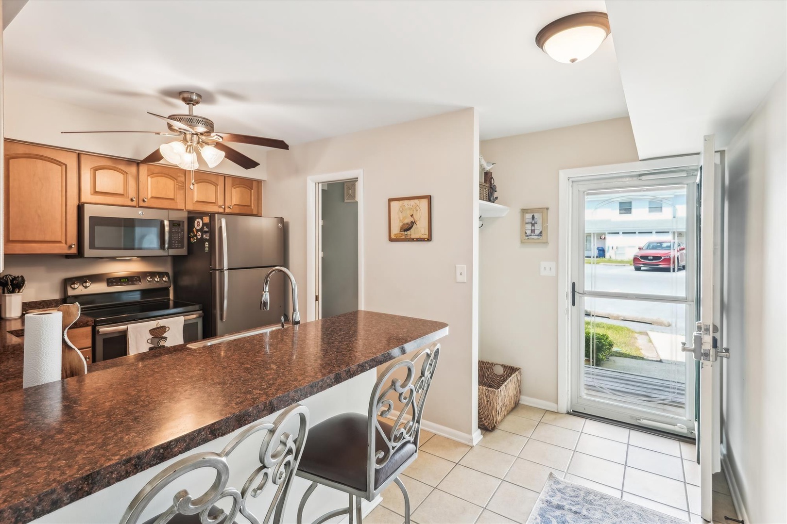 Your fully equipped kitchen features granite countertops, stainless steel appliances, and bar seating—perfect for preparing meals and gathering with friends.