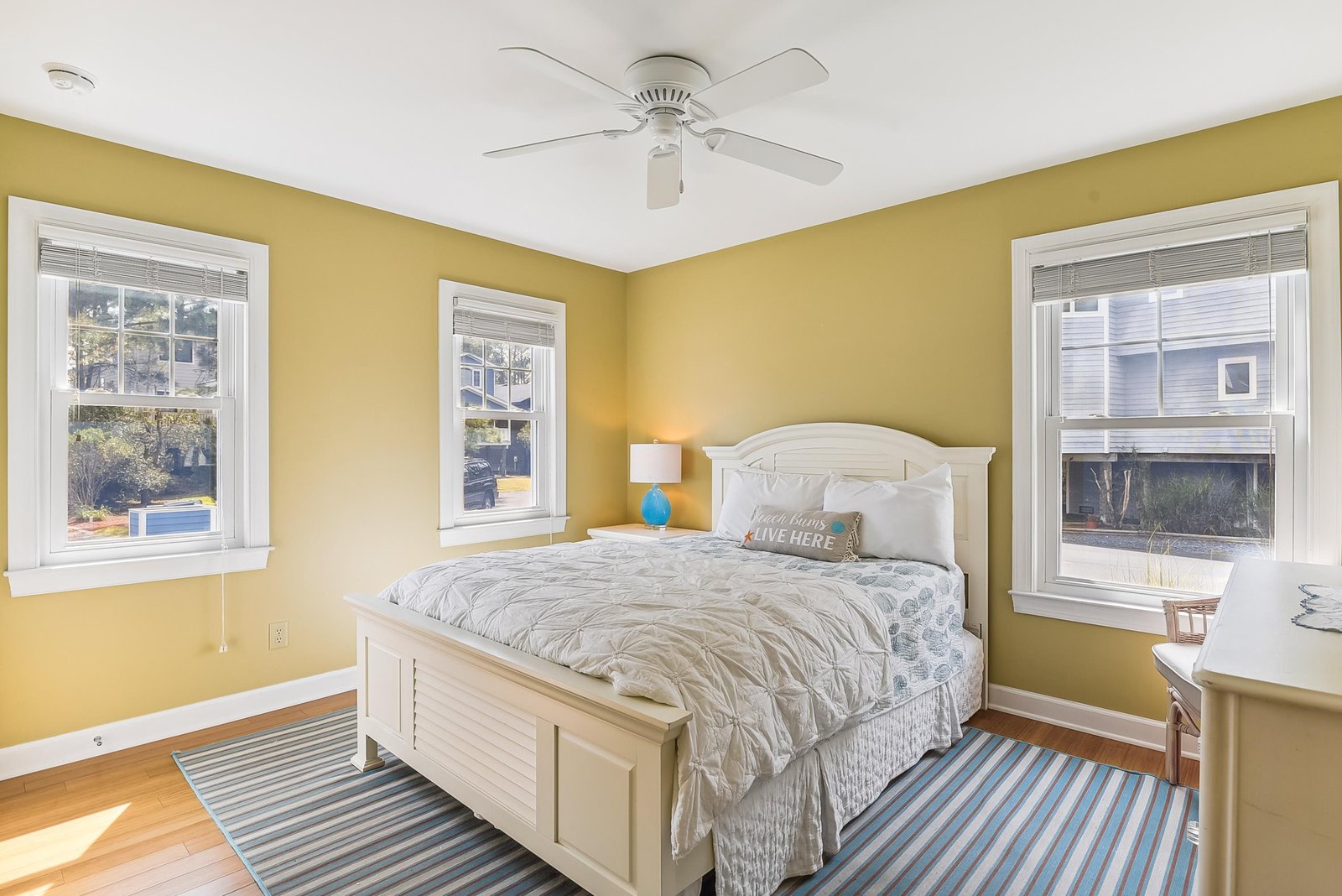 Wake up to natural light pouring through three large windows in your cheerful, sun-kissed bedroom. Soft breezes and a cozy coastal vibe help you unwind after a day exploring.