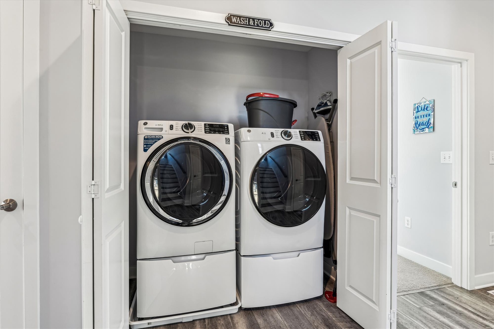 Keep your clothes fresh in this convenient laundry nook with full-size washer and dryer.