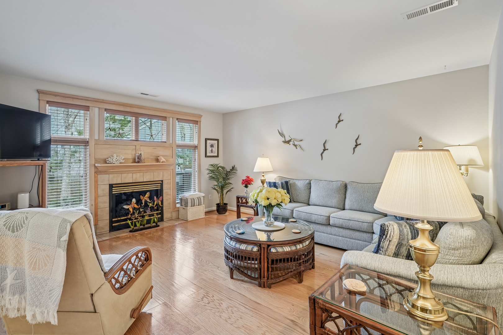 Sink into plush seating by your crackling fireplace, where warm lighting and thoughtful decor create the perfect retreat for relaxing evenings.