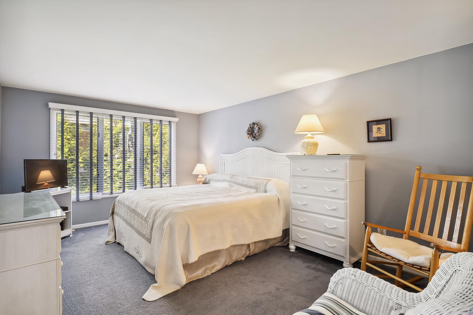 Unwind in your peaceful bedroom, where soft textures, gentle lighting, and charming accents create a soothing retreat for restful nights.