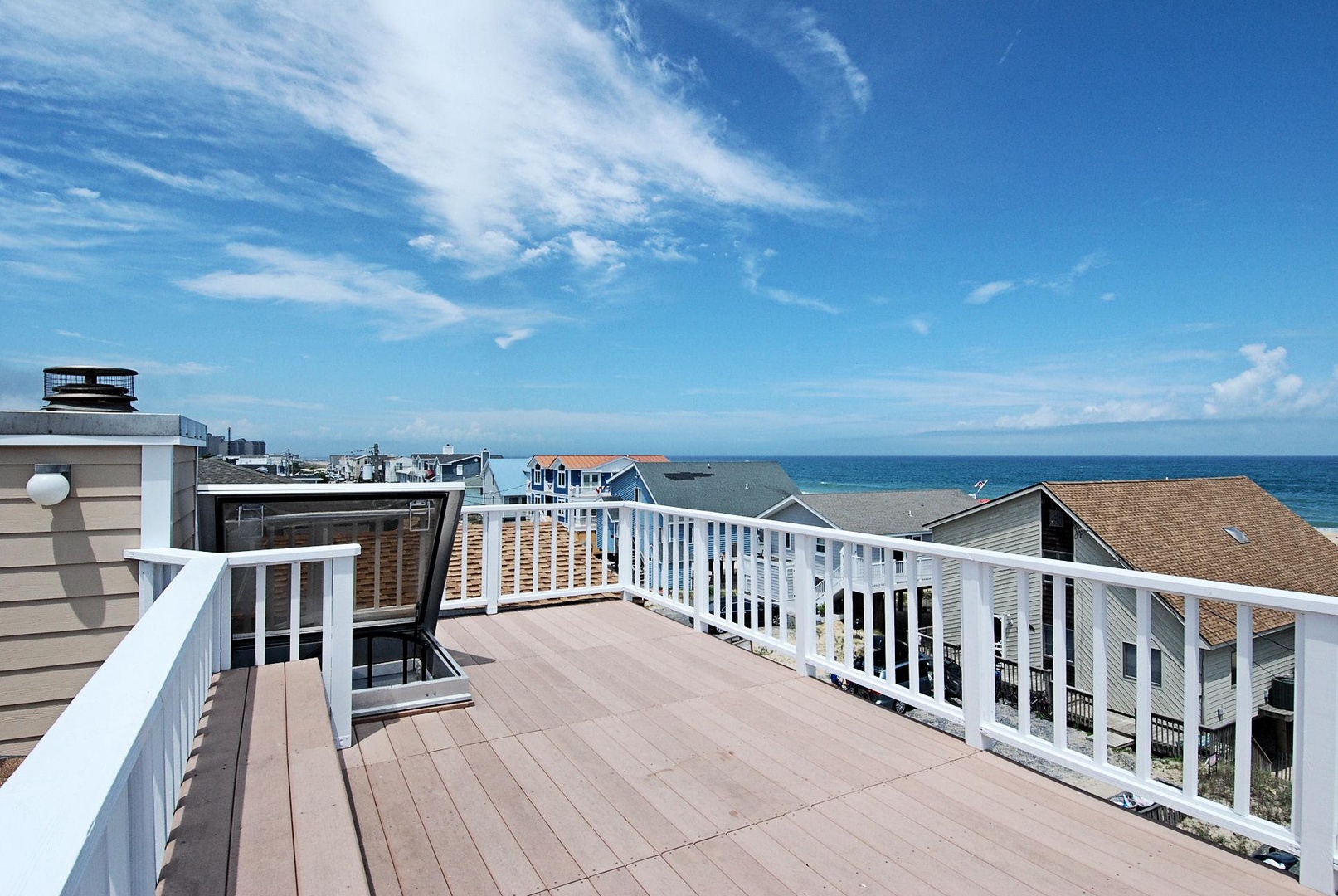 Spacious rooftop terrace overlooking the sparkling ocean, where you can soak up endless coastal views and feel the refreshing sea breeze.