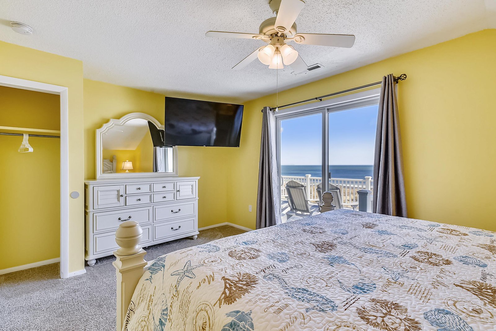 Wake up to stunning ocean views from your bedroom window, where sunlight and fresh sea breezes fill the cheerful space. Step onto your private balcony for morning coffee with endless blue horizons.