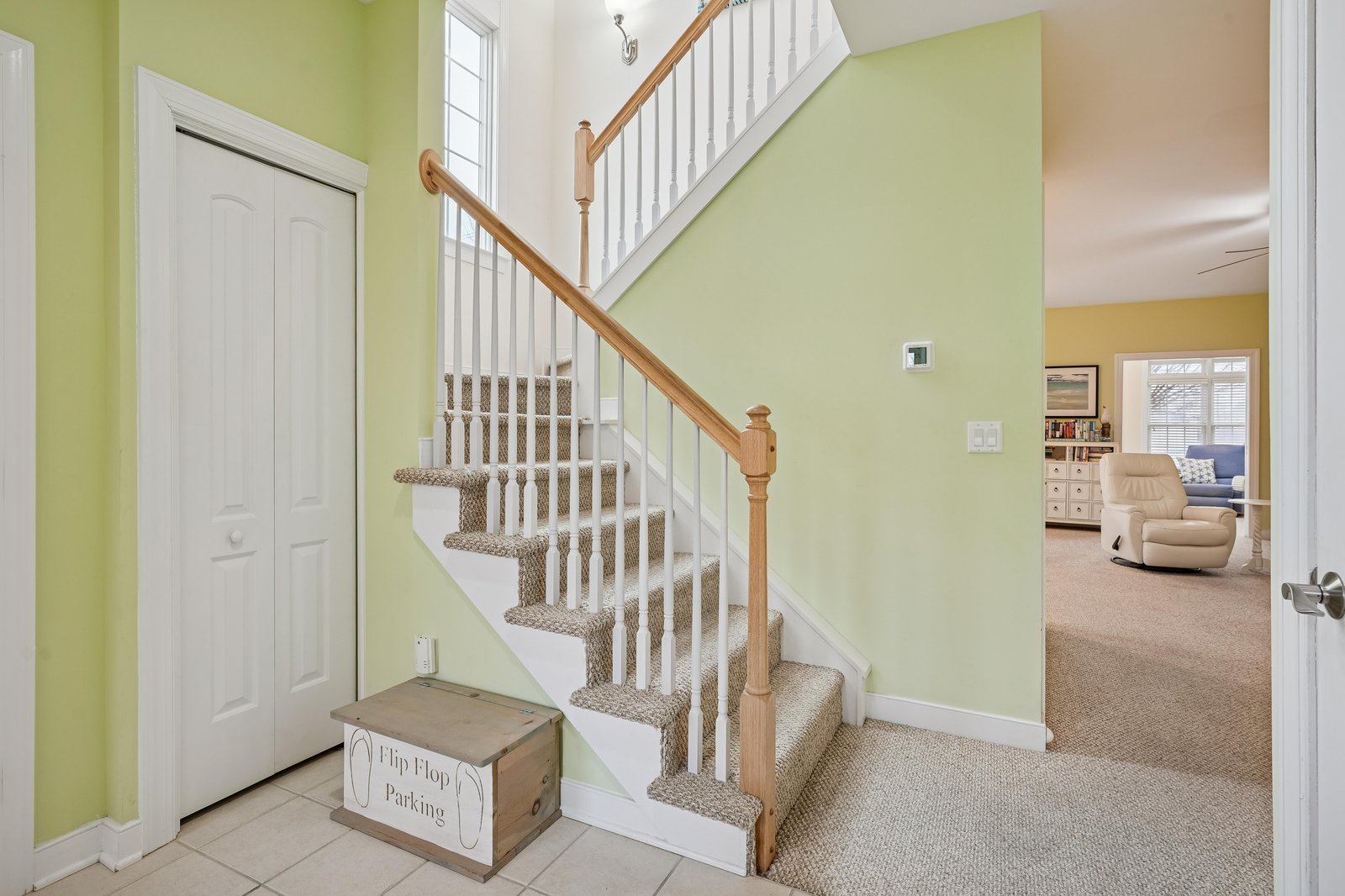 Step inside to find bright, cheerful walls and a welcoming staircase leading to your upstairs retreat. Your adventure begins here, where thoughtful touches await your arrival.