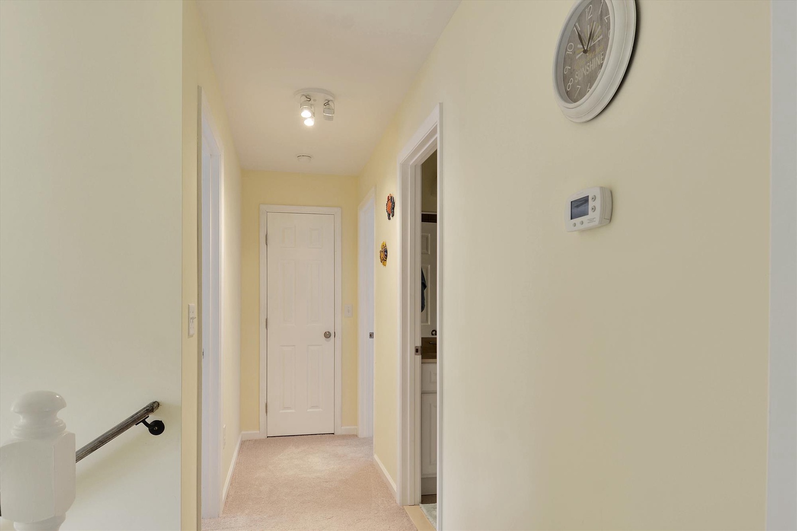 A bright, welcoming hallway with warm lighting and climate control connects you to all areas of your rental, ensuring your comfort year-round.