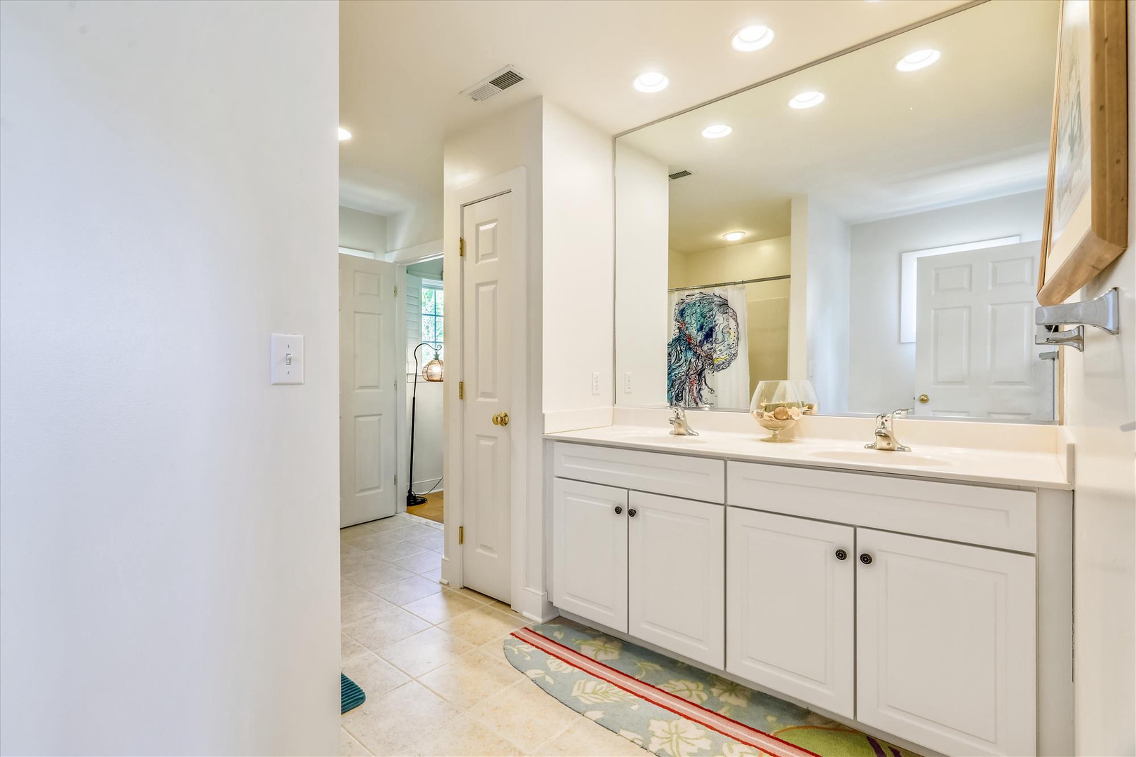 Your private bathroom features a bright vanity with ample counter space, soft lighting, and a refreshing, clean design perfect for your morning routine.