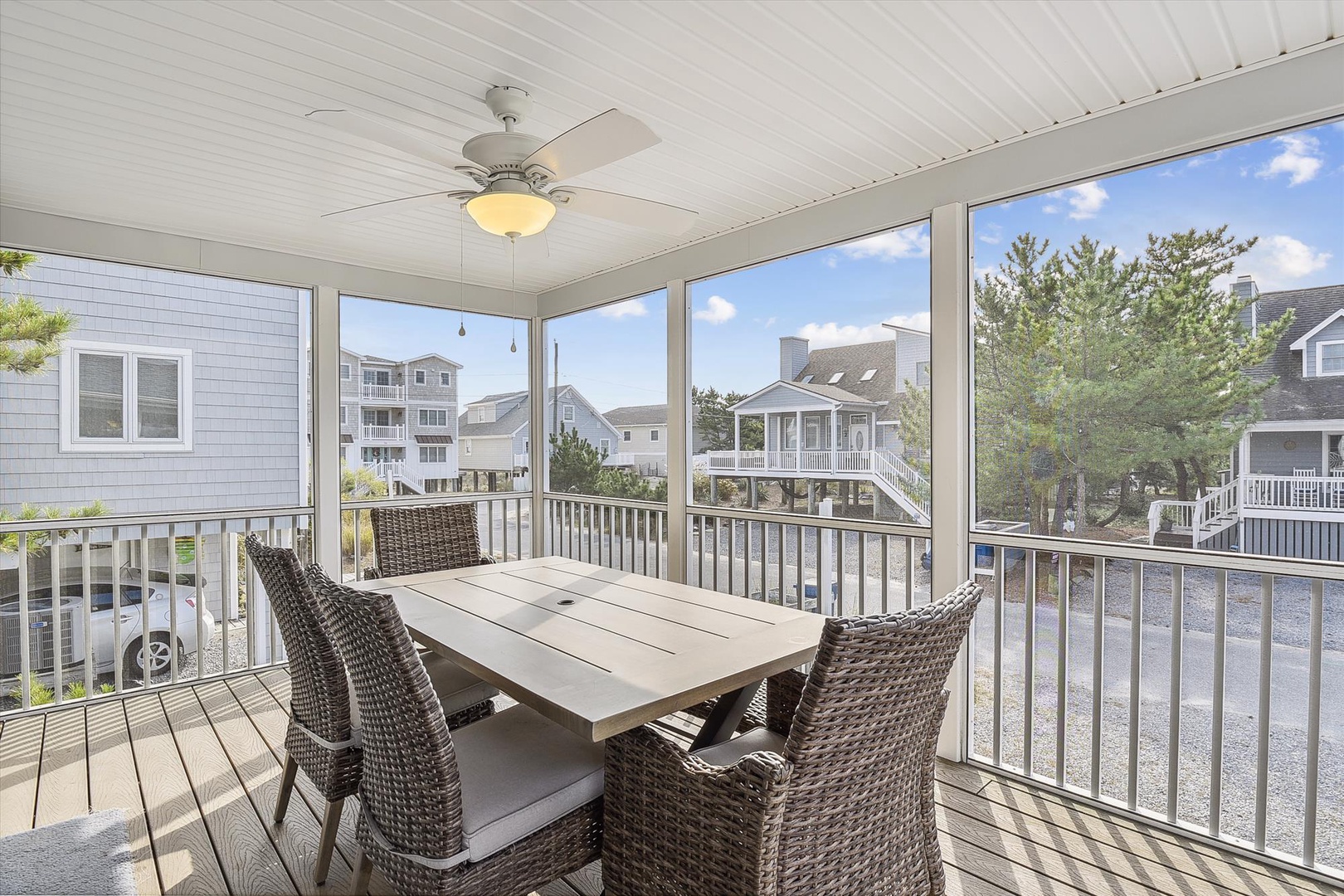 Enjoy your morning coffee or evening meals at this screened-in porch, where you're protected from bugs yet surrounded by natural light and neighborhood views.