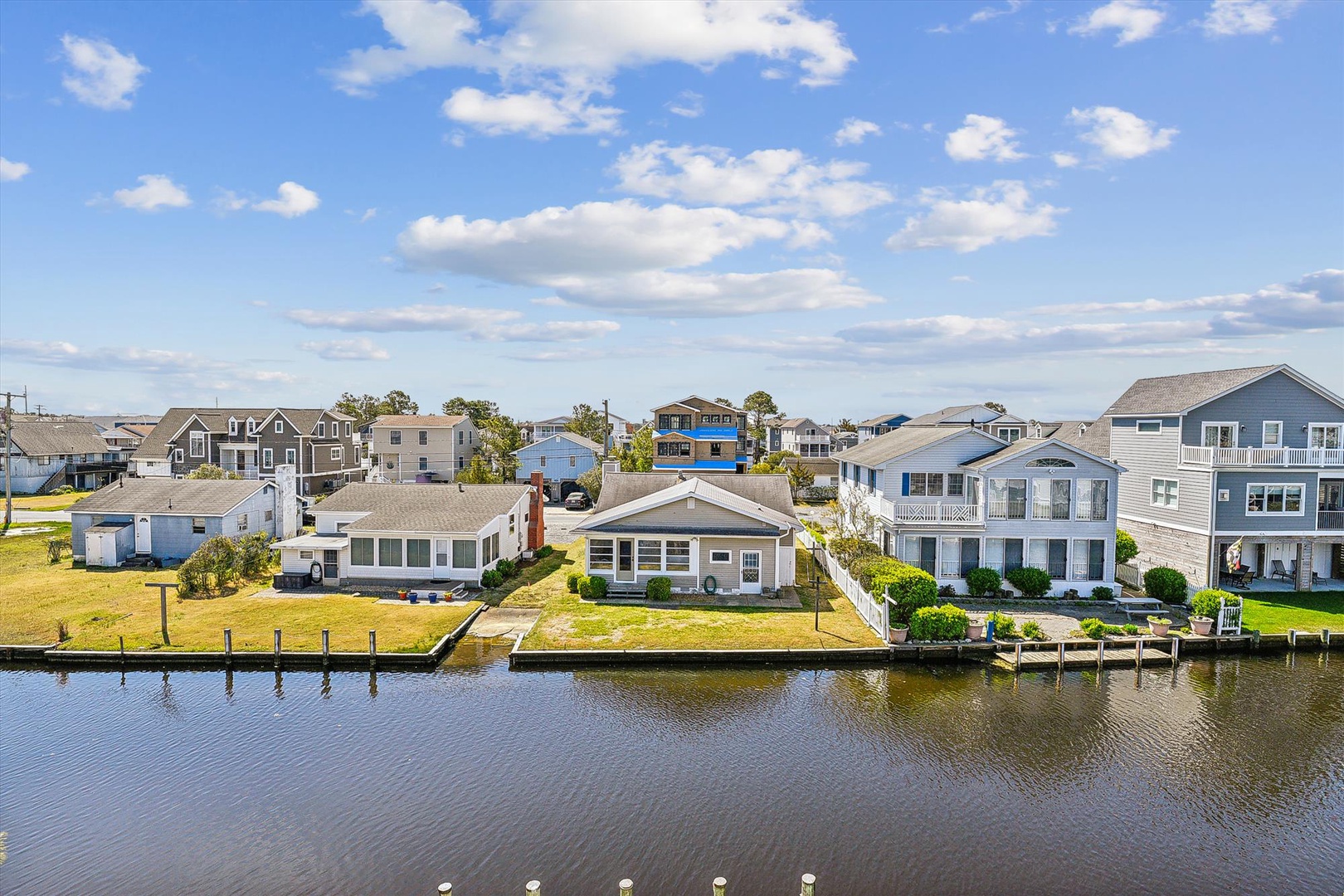 Waterfront rental properties in a serene coastal neighborhood with private docks and canal access, ideal for boating enthusiasts.