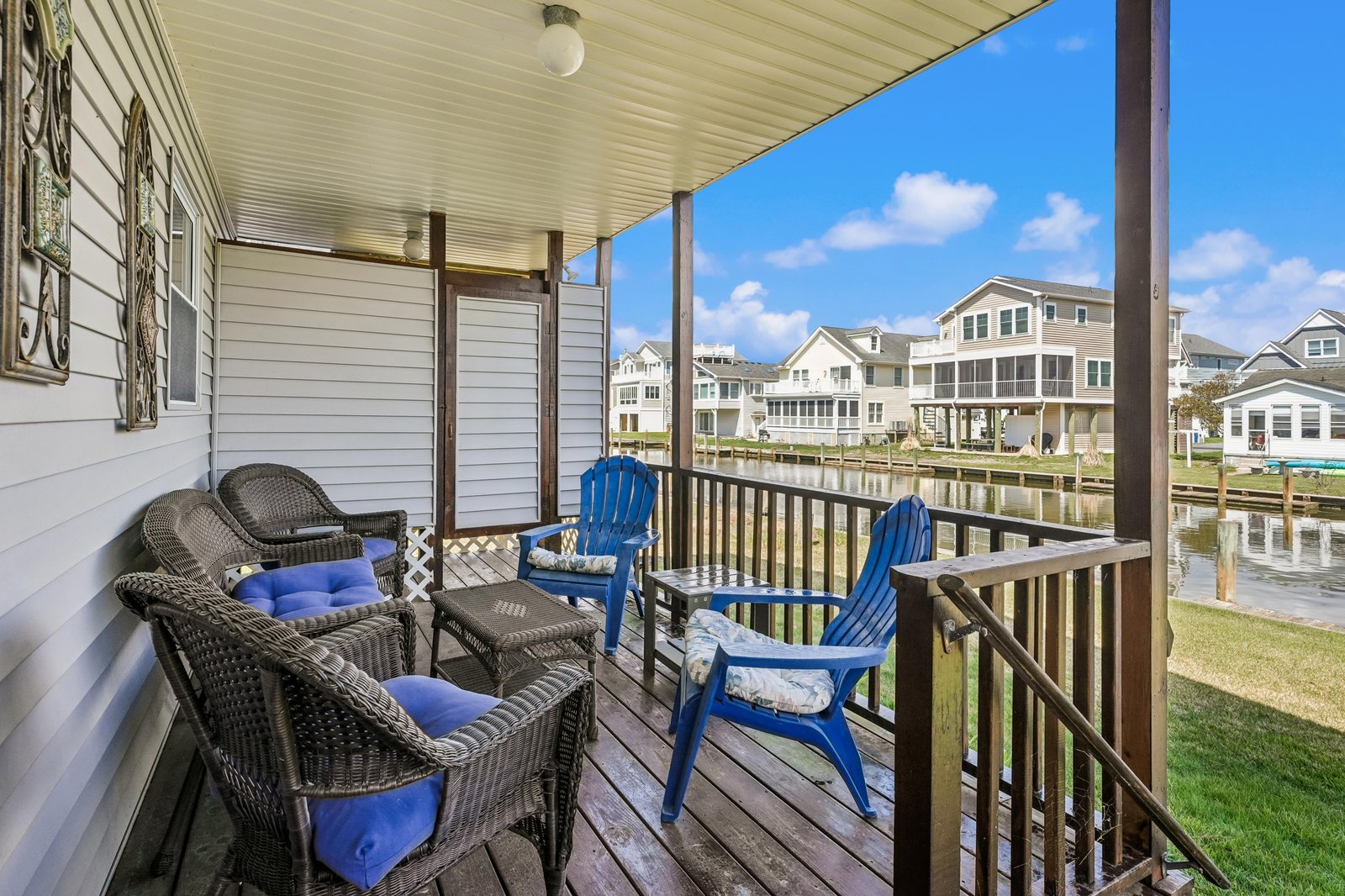 Sip your morning coffee on your private covered balcony, where peaceful canal views and blue skies set the tone for a relaxing coastal getaway.