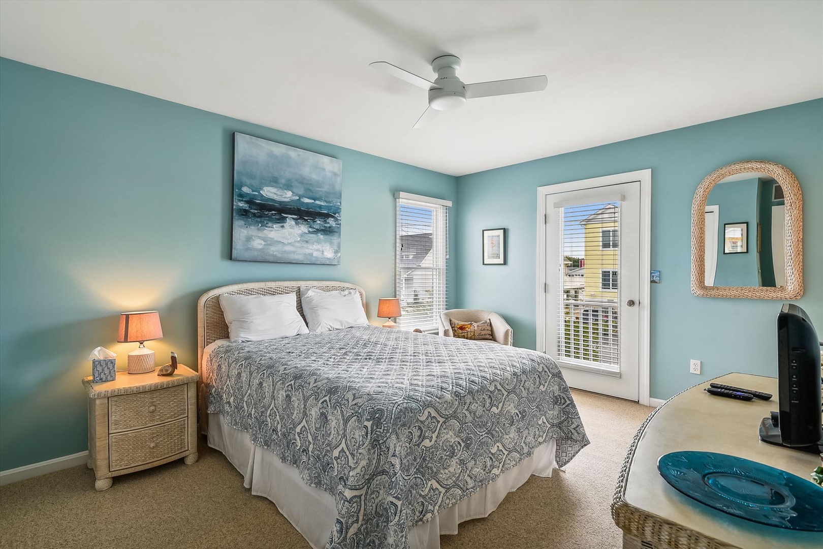 Drift into restful sleep in your coastal-inspired bedroom, where soothing sea-blue walls and soft linens create a tranquil retreat after days exploring the beach.