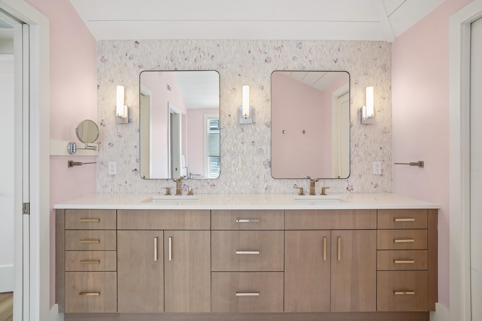 Step into your elegant en-suite bathroom, where soft pink tones and marble textures create a serene, spa-like atmosphere—your private retreat to unwind after a day of exploring.