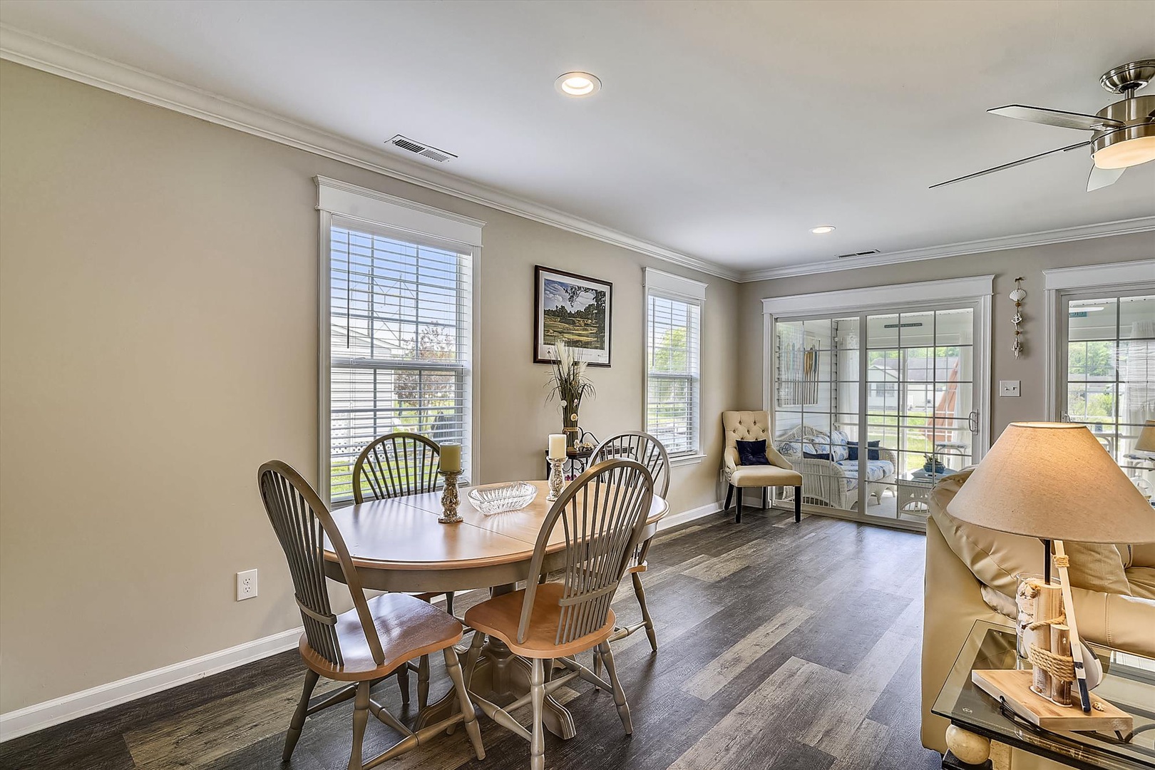 Picture yourself enjoying morning coffee at this inviting dining table, bathed in natural light from large windows. The elegant space opens to your private outdoor retreat, perfect for relaxing evenings.