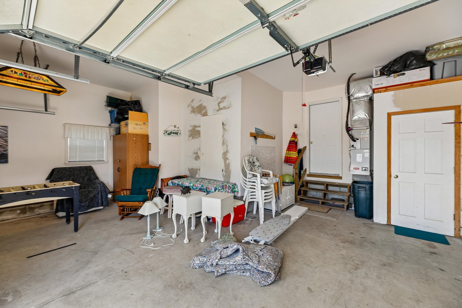 This dedicated garage includes additional storage space for your convenience. The area provides easy property access and secure parking for your vehicle during your stay.