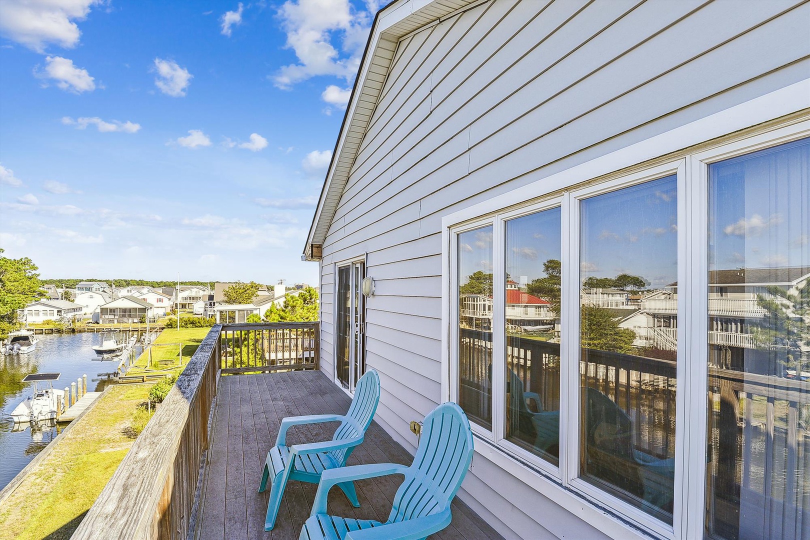 Step out onto your private deck with two Adirondack chairs and take in the serene waterway views, surrounded by peaceful neighborhood charm.