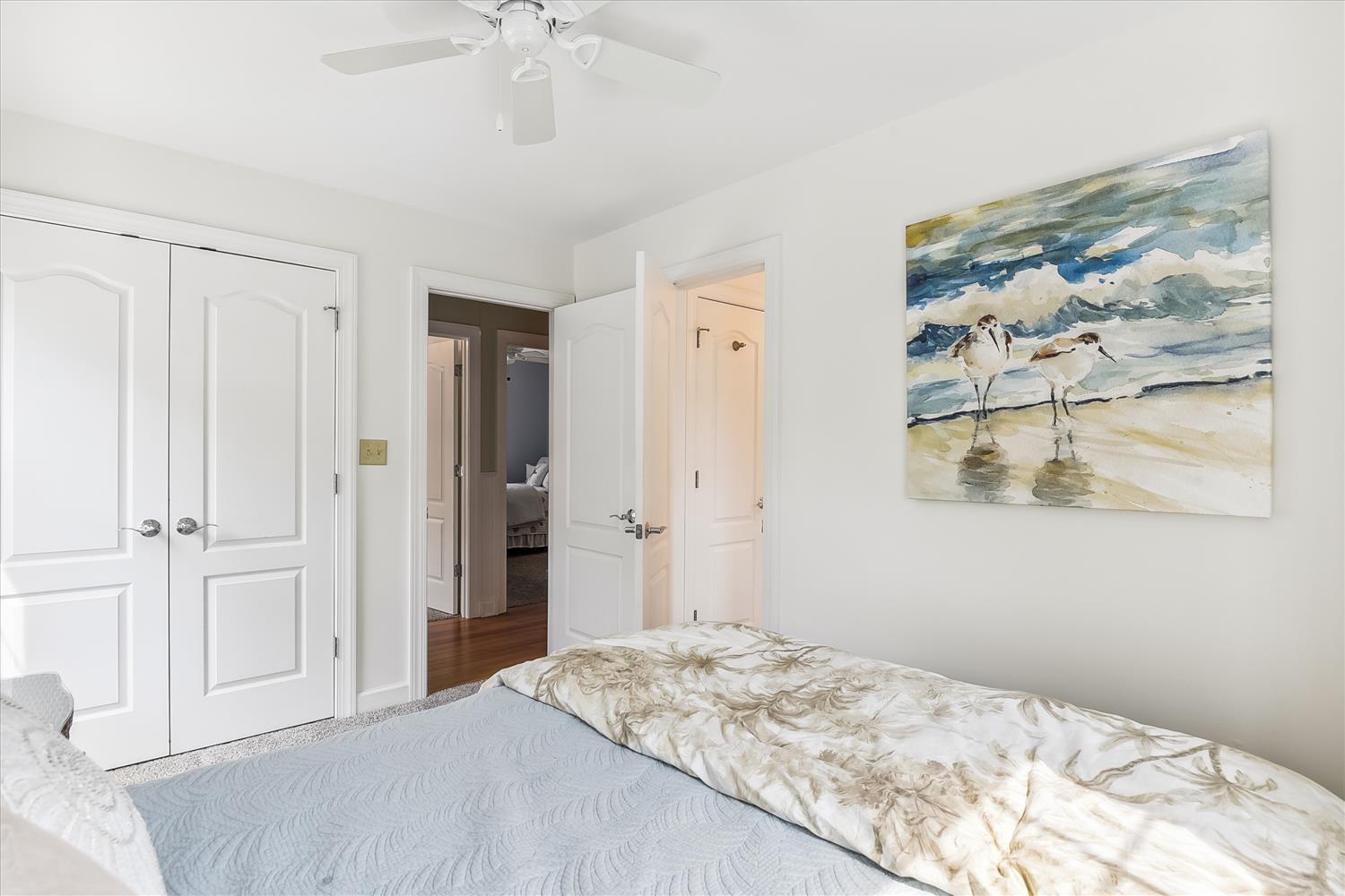 Drift off in this serene coastal bedroom, where soft linens and breezy décor invite you to unwind and recharge for your next beach adventure.
