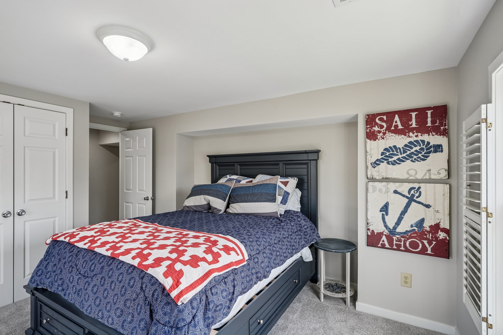 Drift off to peaceful dreams in your nautical-themed bedroom, complete with cozy bedding and charming maritime artwork that whispers of ocean adventures.
