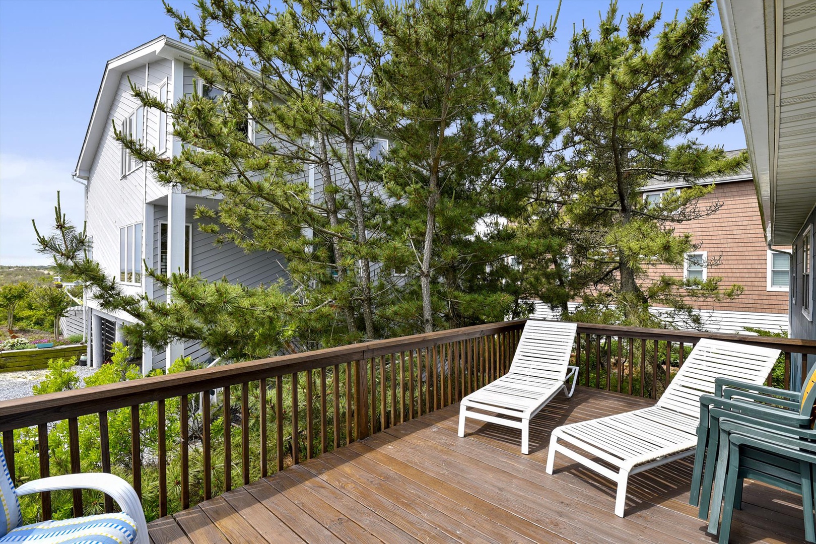 A coastal retreat nestled among evergreens, offering a peaceful escape in a quiet neighborhood near the shore.