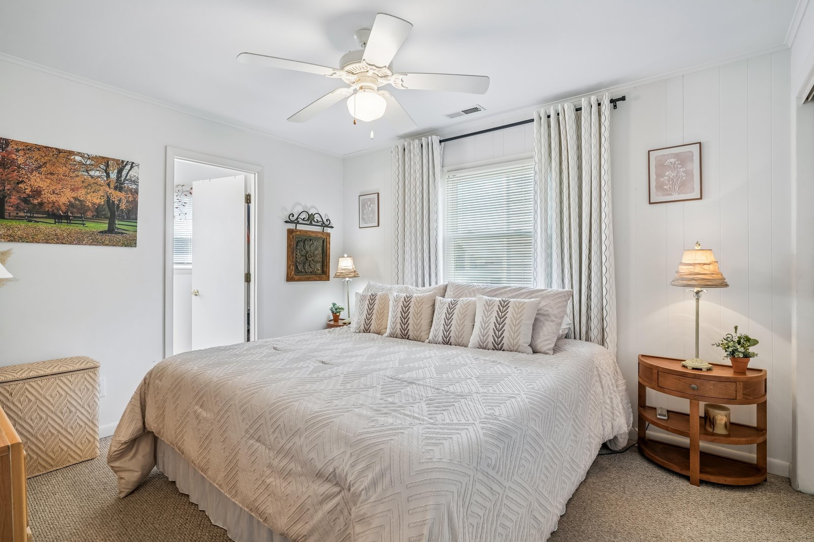 Settle in and unwind in your serene bedroom with neutral tones, soft bedding, and warm touches of wood and natural light to ease you into restful nights.