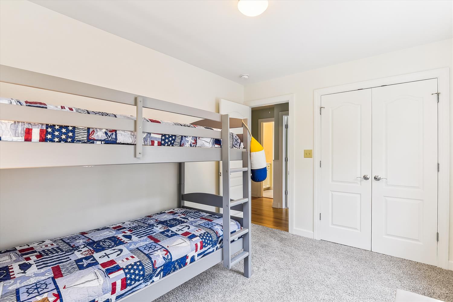 Your kids will love their own nautical-themed bunk room, complete with plenty of storage to stash their treasures after sunny beach days.