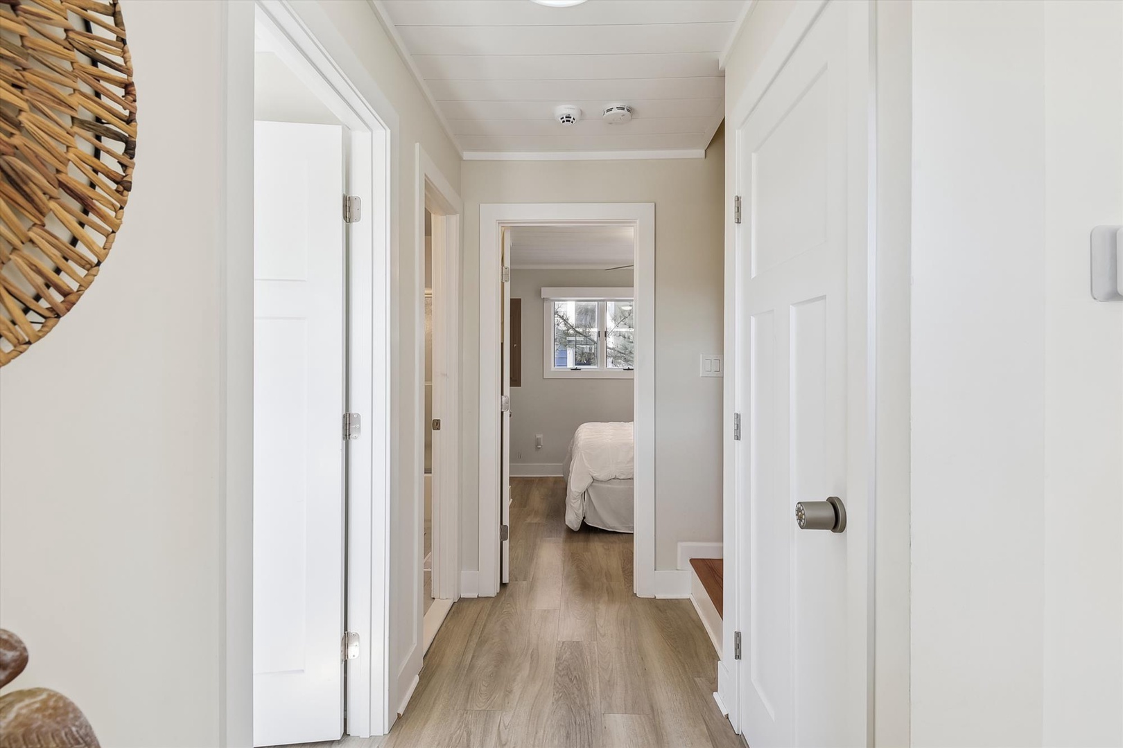 This bright hallway connects your private bedroom to the rest of your rental, offering smooth transitions and a clean, welcoming design throughout your stay.