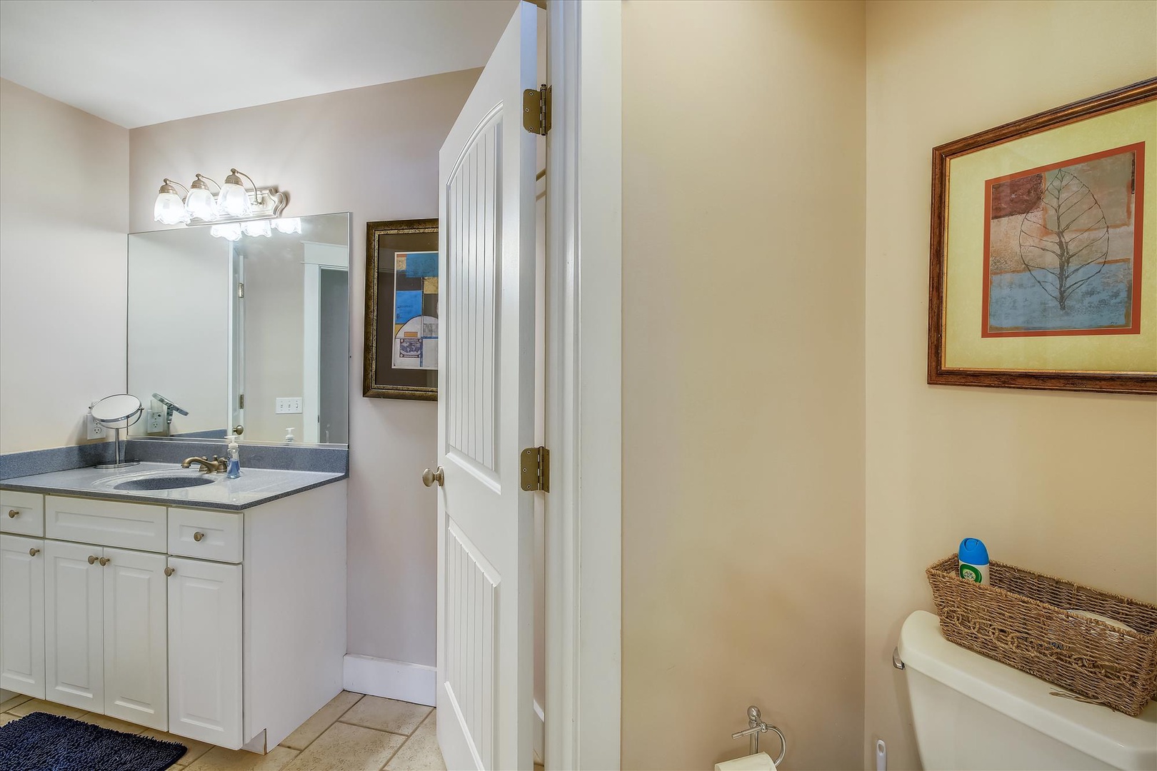 Step into your private bathroom with a well-lit vanity, ample storage, and thoughtful touches like a bidet for added comfort during your stay.